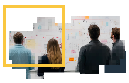 group of people looking at a whiteboard with notes